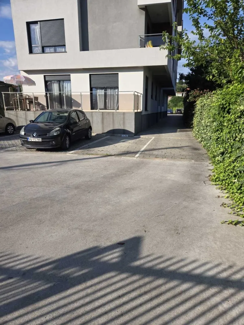 Parking space in front of a residential building.