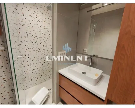 Modern bathroom with a shower cabin, washbasin, and mirror. - image 10