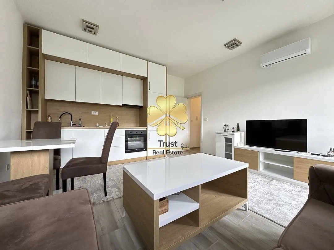 Spacious living room with a dining area and modern kitchen.
