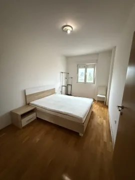 Bedroom with a double bed and a bedside table. - image 4