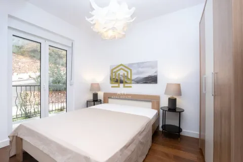 Bedroom with a double bed, wardrobe, and access to the terrace. - image 7