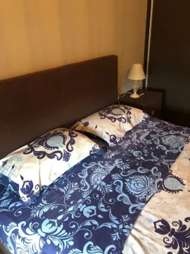 Furnished bedroom with a double bed and a nightstand. - image 6