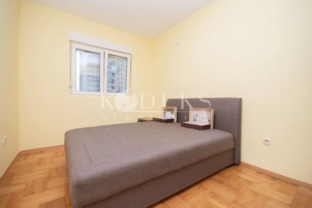 Bedroom with a double bed and a window.