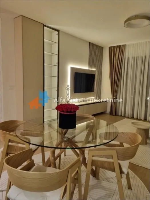 Living room with a dining table and modern furniture.
