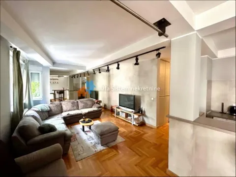 Spacious living room with a sofa set and parquet flooring. - image 18