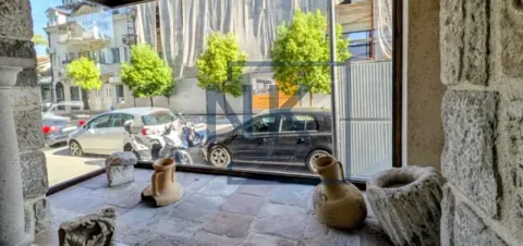 View from the interior with stone details towards the street and parked cars. - image 15