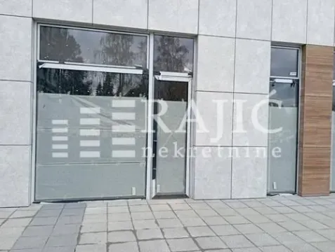 Exterior of a commercial space with a modern facade and large glass surfaces. - image 5