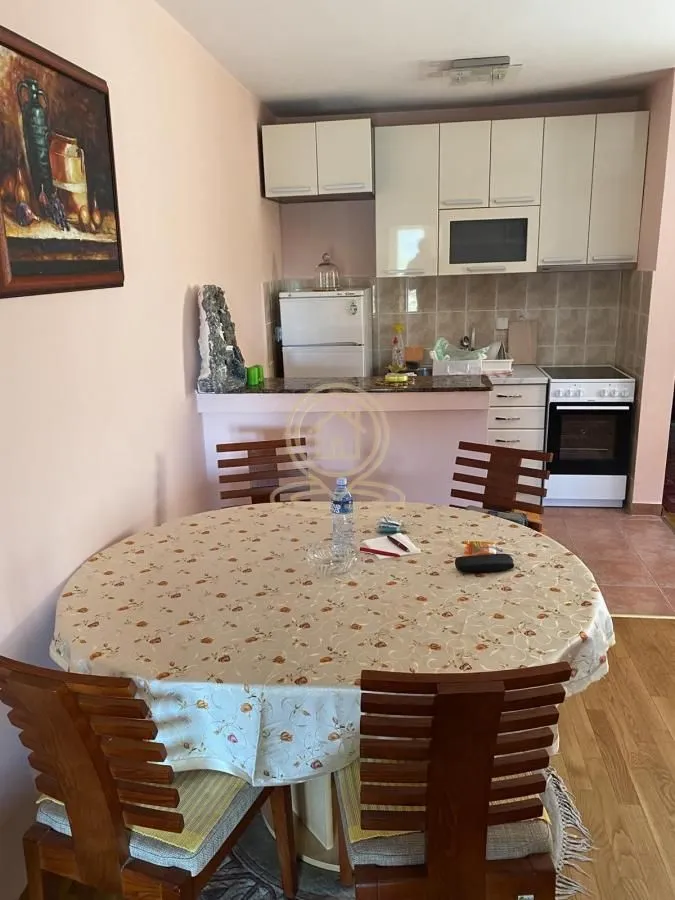 Smaller kitchen with a dining table and chairs.