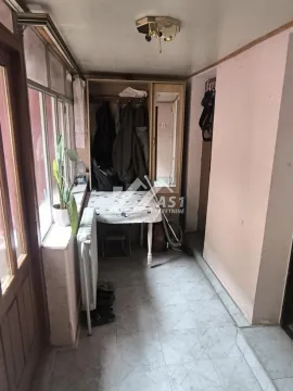 Enclosed terrace with a wardrobe, table, and tiled floor. - image 8
