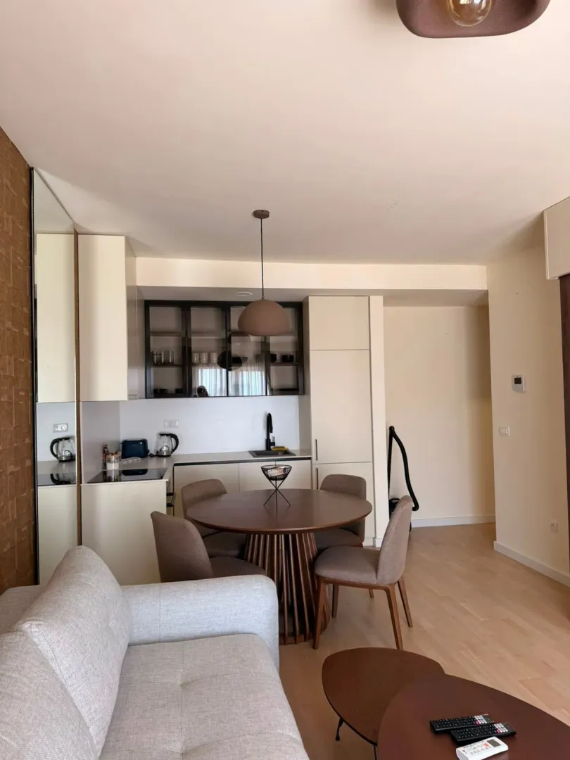 Open-plan space with a kitchen, dining area, and part of the living room.