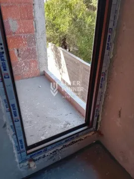 View through the balcony door onto the terrace under construction. - image 12