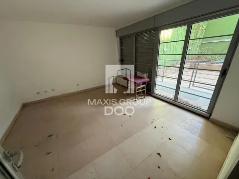 Empty room with tiled floors and large glass doors leading to a terrace. - image 9