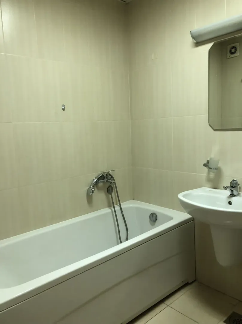 Bathroom with a bathtub and sink.