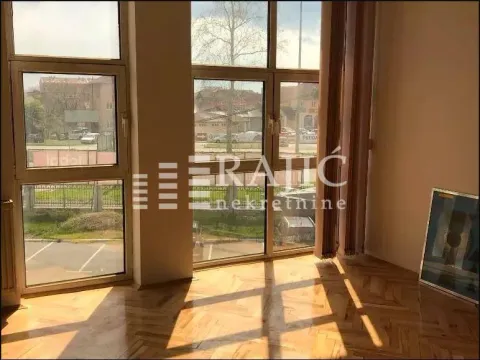 Empty room with large windows and parquet flooring. - image 4