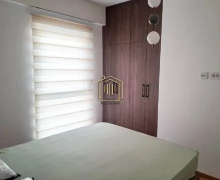 Bedroom with a double bed and a fitted wardrobe. - image 3