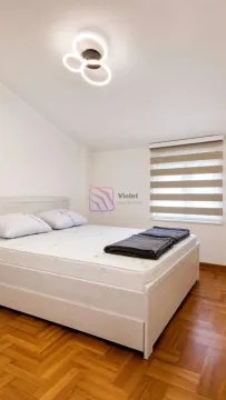 A bedroom with a double bed and hardwood flooring. - image 8
