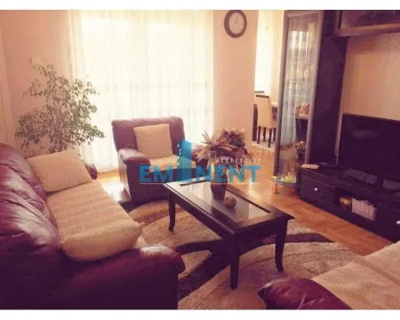 Living room with sofa set, coffee table, and TV. - image 2