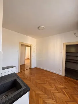 Kitchen with a sink and wooden parquet flooring. - image 5