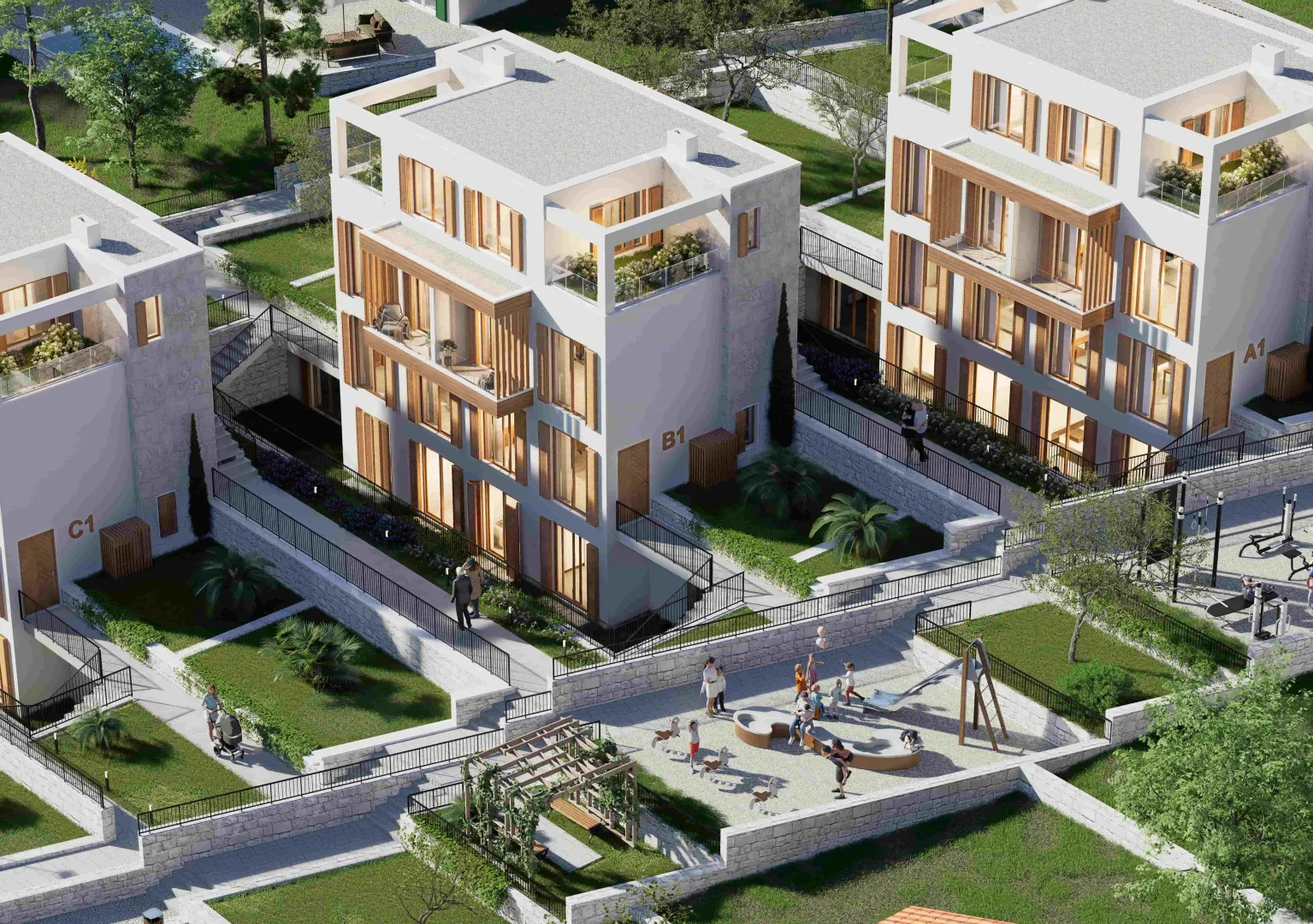 Pogled iz vazduha na kompleks modernih zgrada sa uređenim dvorištem i igralištem.