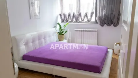 Bedroom with a large double bed and a window. - image 9