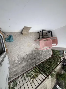 Unfurnished balcony with a metal railing and chairs. - image 16