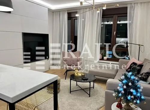 Modern and bright living room with a sofa and dining table.