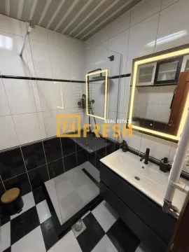 Modern bathroom with a walk-in shower and a sink. - image 8