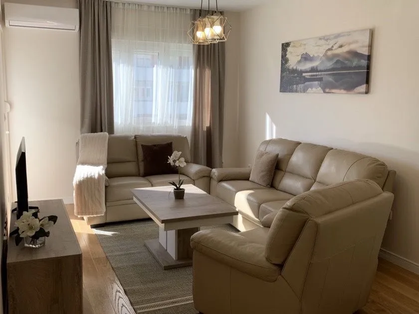 Furnished living room with a seating set and a coffee table.