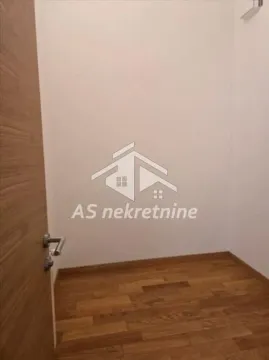 Empty room with wooden flooring and a door. - image 9