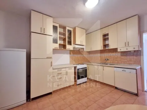 Small kitchen with light-colored cabinetry and ceramic floor tiles. - image 4