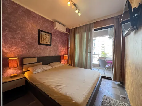Furnished bedroom with a double bed and access to the balcony. - image 11