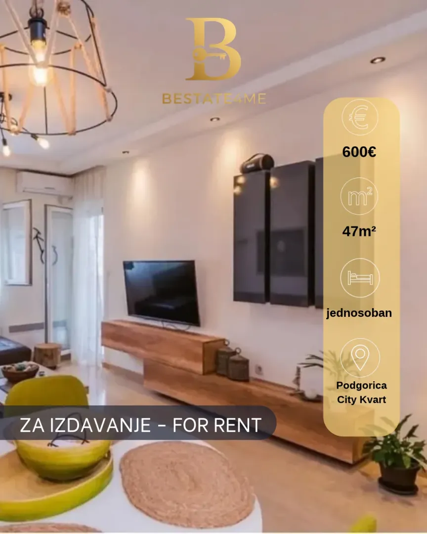 Living room with sofa, TV and dining table.