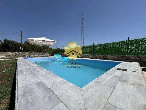 Yard with a swimming pool and paved patio. - image 3