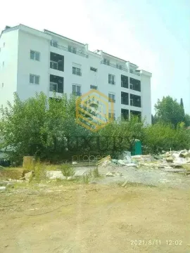 View of the exterior of the residential building and surroundings. - image 2