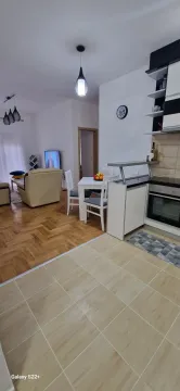 Modern kitchen connected to the dining area and living room. - image 5
