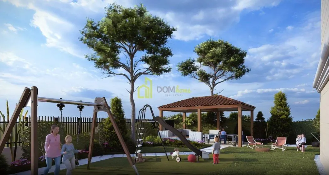 View of the landscaped yard with a playground and a gazebo.
