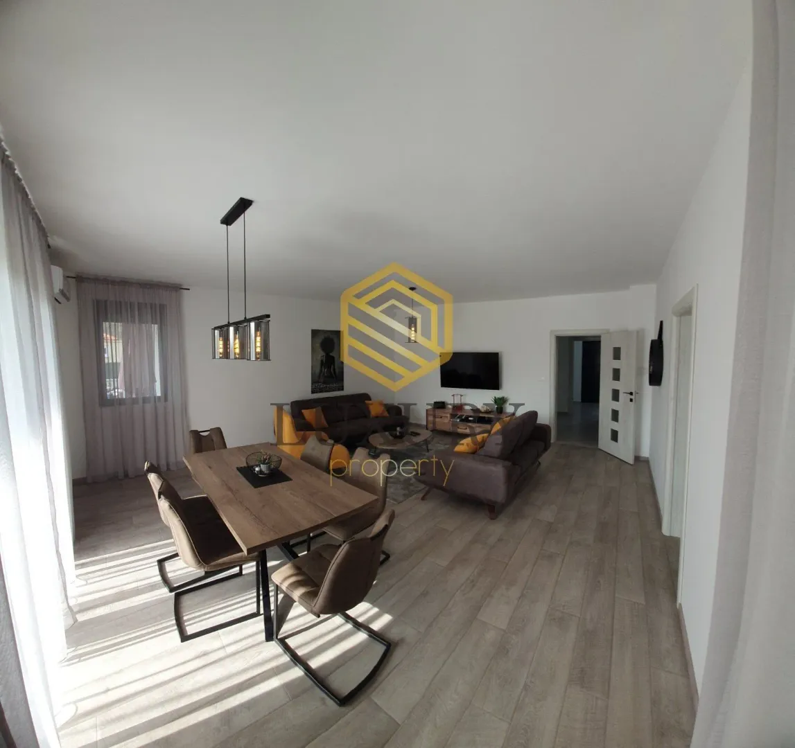 Spacious living room with a dining area and modern furniture.