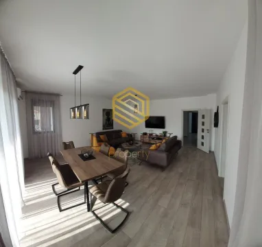 Spacious living room with a dining area and modern furniture. - image 9