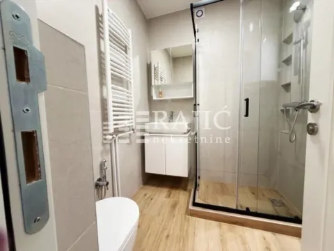 Modernly equipped bathroom with a shower cabin. - image 7