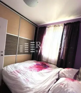 Bedroom with a double bed and a built-in wardrobe. - image 9
