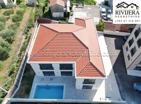 Aerial view of the house with a swimming pool and yard. - image 2