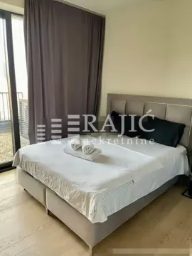Furnished bedroom with a double bed and access to the terrace. - image 17