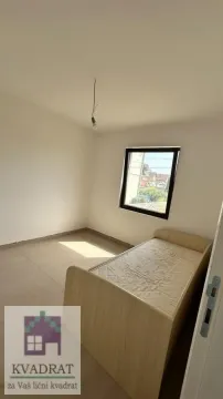 Small room with a bed and a window. - image 16