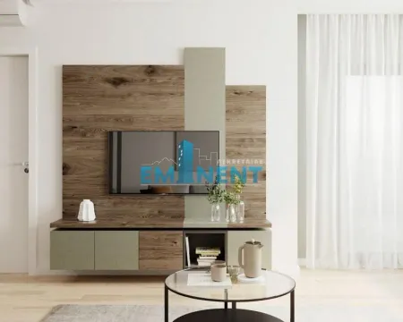 Living room with modern wall paneling and a television. - image 2
