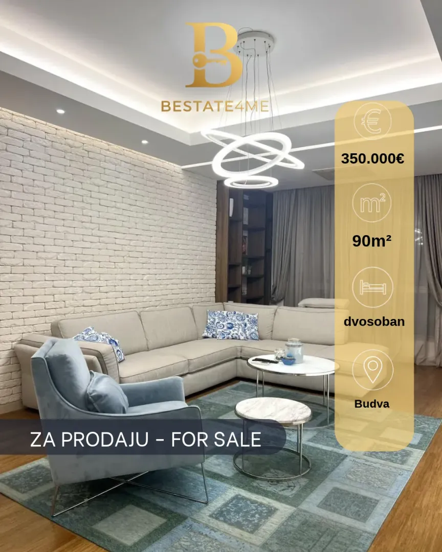 Dnevna soba sa ugaonom garniturom, foteljom i modernim lusterom.