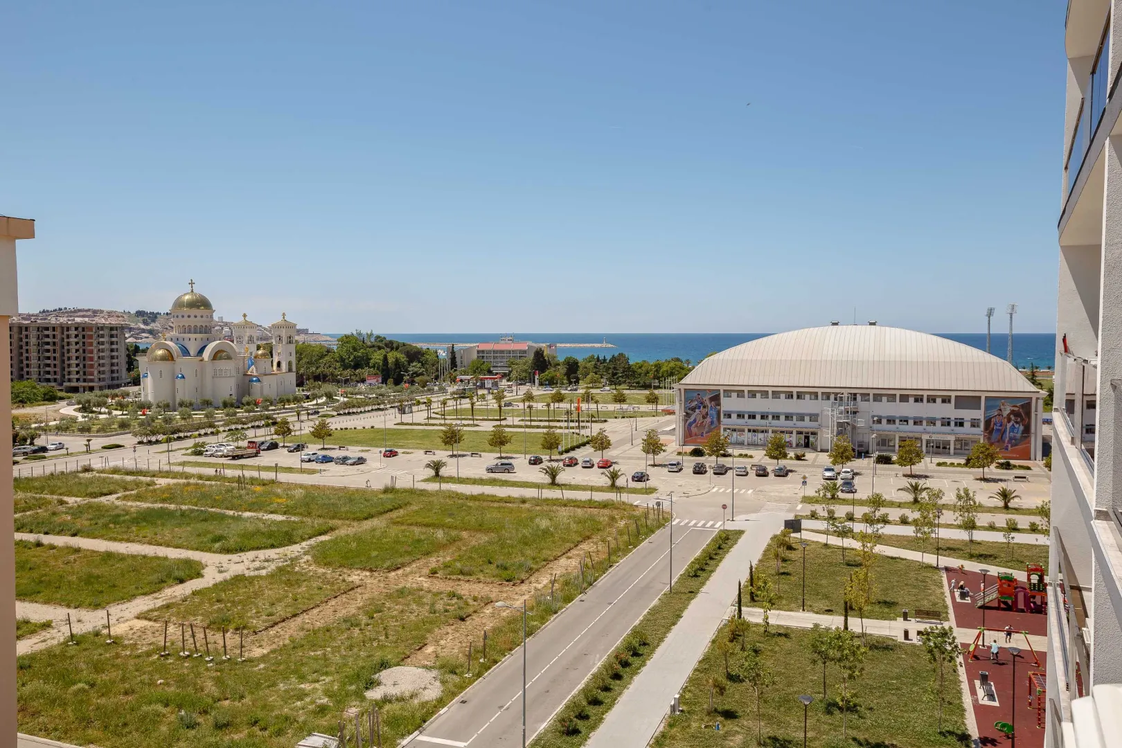 View from the terrace towards the city, church, and sea.