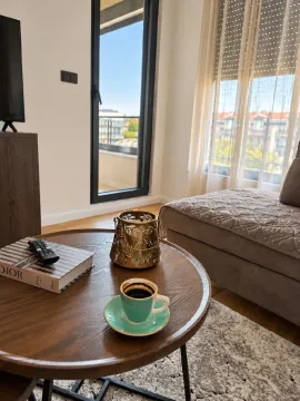 Living room with sofa and coffee table. - image 6