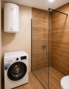 Moderno opremljeno kupatilo sa tuš kabinom, bojlerom i veš mašinom. - image 7