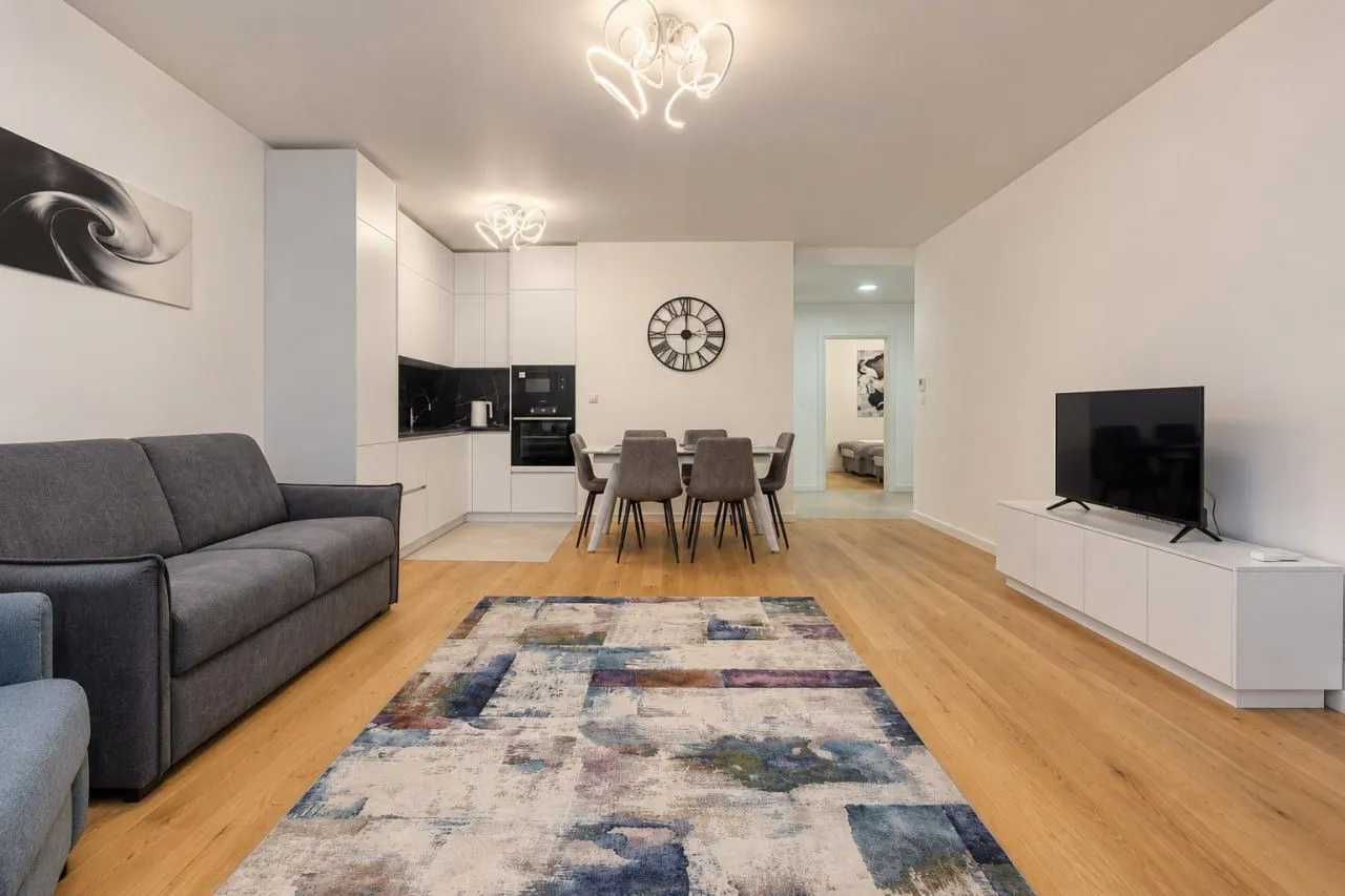 Spacious living room connected to the dining area and kitchen.