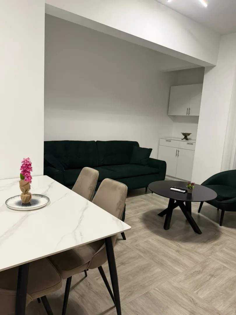 Living room with dining area and modern furniture.